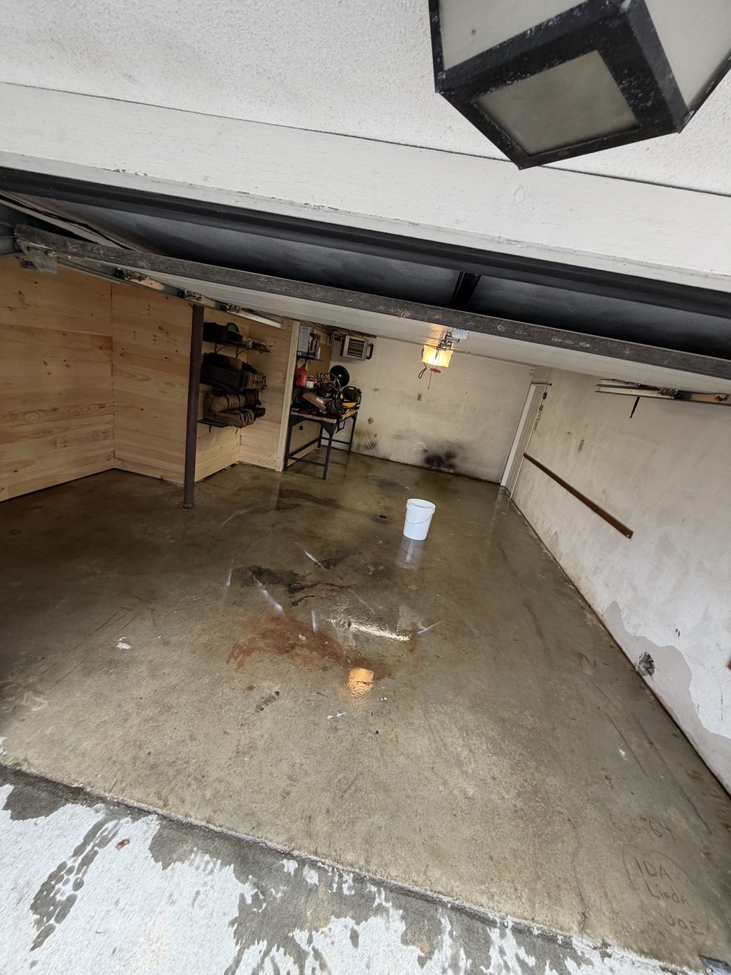 Bare, unfinished concrete garage floor before coating